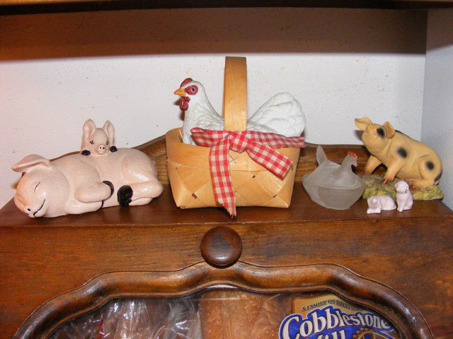 pig and hen decor on top of bread box